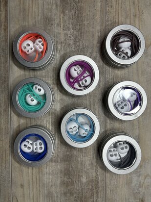 Knitting cord in metal tin with stoppers